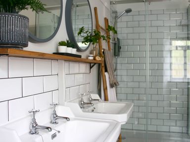 A bathroom with dual washbasins and a shower at Beautiful 6Bed Sleeps 12 Stunning Views in Lynton
