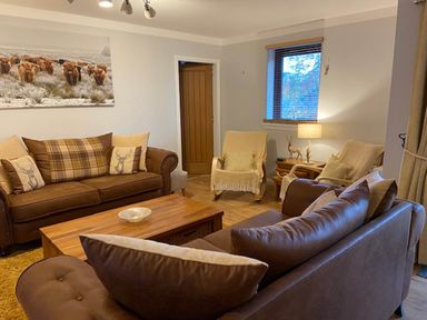 A living room with a sofa and armchairs at Blairgowrie Luxury 3 Bed Lodge with Hot Tub in Blairgowrie