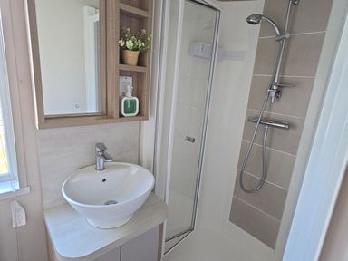A bathroom with a shower and a sink at 2Br Lodge Pool Fireplace PetsOK Parking Goonhavern