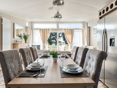 A dining room with a table set for meals at 2Br Lodge Pool Fireplace PetsOK Parking in Goonhavern