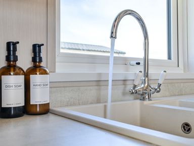 A kitchen with a sink and soap dispensers at 2Br Lodge Pool Fireplace PetsOK Parking Goonhavern