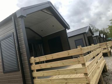 Lodges with wooden decking and shutters at Selfcatering Lodge Inverness Sleeps 4 Inverness