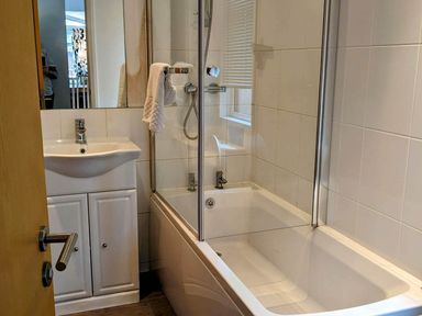 A bathroom with a bathtub and sink at Felmoor Park Northumberland Lodge with Hot Tub, Felmoor Park near Felton