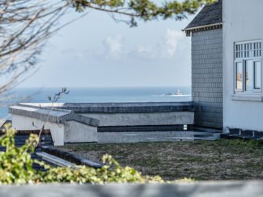 A view of the sea from a building overlooking the coast at 1 Bedroom Apartment Sleeps 2 Pets Welcome in Carbis Bay