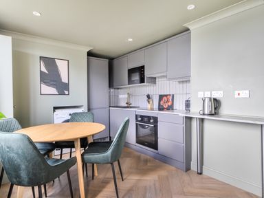 A kitchen with a table and chairs at 1 Bedroom Apartment Sleeps 2 Pets Welcome in Carbis Bay