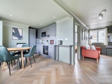 A kitchen with a dining table and chairs at 1 Bedroom Apartment Sleeps 2 Pets Welcome in Carbis Bay