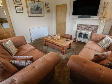 A living room with sofas and a coffee table at The Hideaway at Monterey Helston