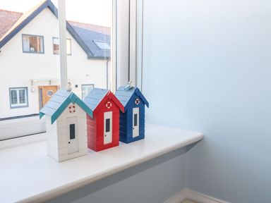 Three toy houses on a windowsill at Bryn Tirion - Rhosneigr