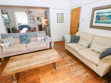 A living room with sofas and a coffee table at Y Glyn in Borth