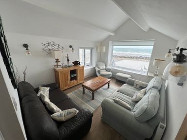 A living room with furniture and a view at Y Glyn in Borth