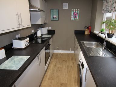 A kitchen with appliances and countertops at Brinkburn House in Scarborough