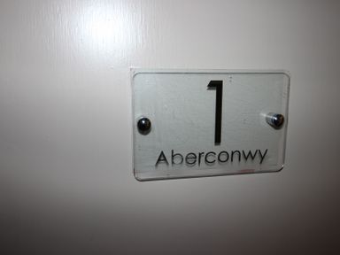 A nameplate with the number 1 and the word Aberconwy