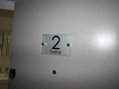 A door with a number sign at Cornerhouse Apartment 2 in Llandudno