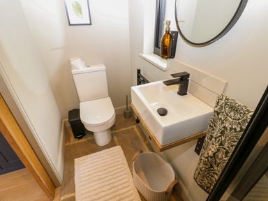 A bathroom with a toilet and sink at 2 West Dunkirk Neuk Hexham