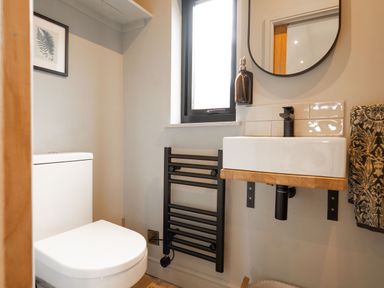 A bathroom with a toilet and sink at 2 West Dunkirk Neuk in Humshaugh