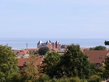 A view of buildings and ocean at 26 Metropole Towers in Whitby