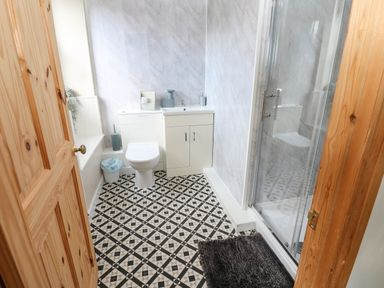 A bathroom with shower and vanity at Prudhoe Cottage in Prudhoe