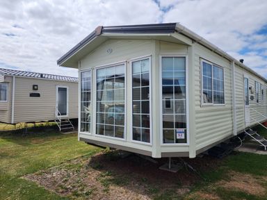 A mobile home with large windows at Whitley bay parkdean resorts - 52 Beechfield Whitley Bay