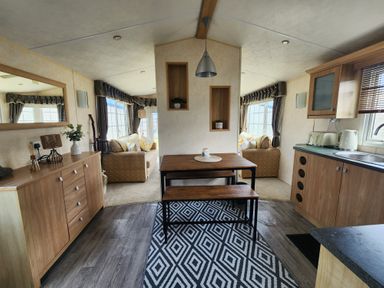 A living room with seating and a dining table at Whitley bay parkdean resorts - 52 Beechfield, Whitley Bay