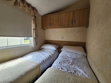 A bedroom with two beds and a window at Whitley bay parkdean resorts - 52 Beechfield, Whitley Bay