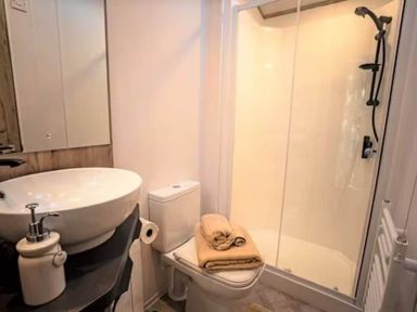 A bathroom with a sink and shower at Findhorn Lodge Peaceful Sleeps 4 Forres