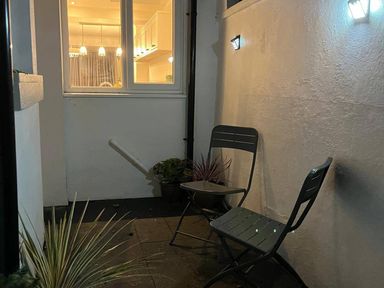 An outdoor seating area with chairs and plants at Charming 3Bed Cottage Private Garden Parking Torquay