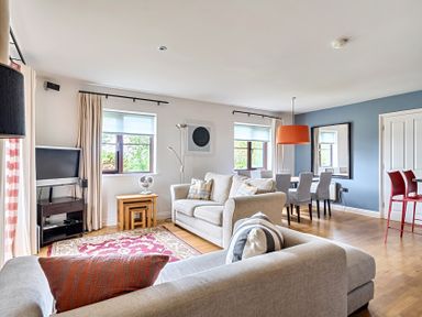 A living room with sofa and dining area at 2bed sleeps4 pool freeparking Trenythonestate near Par