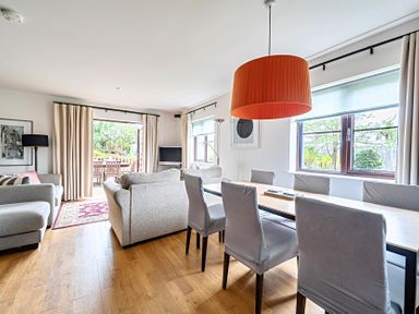 A living room with a dining area and sofas at 2bed sleeps4 pool freeparking Trenythonestate Near Par