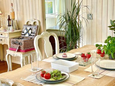 A dining room with a table set for a meal at Stunning Sleeps 6 Luxury Lodge Pets Mercia Marina near Willington, Derbyshire