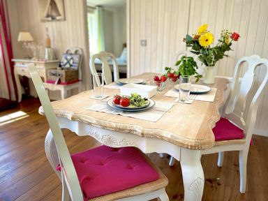A dining room with a wooden table and chairs at Stunning Sleeps 6 Luxury Lodge Pets Mercia Marina near Willington, Derbyshire