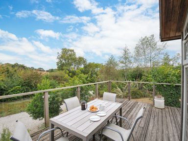 An outdoor area with a table and chairs at 5 Tree Tops Dobwalls
