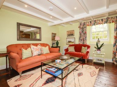 A living room with sofas and a coffee table at The Homestead in 