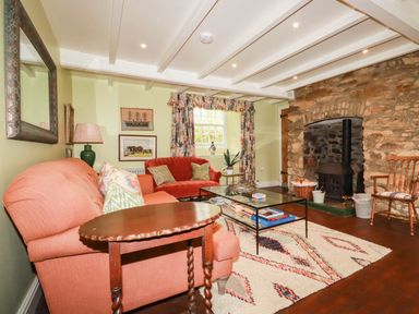 A living room with a sofa and coffee table at The Homestead 