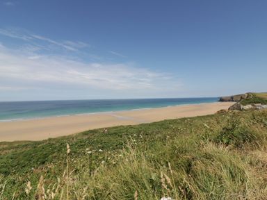 A beach with sand and ocean view at The Homestead in Trerice near Newquay