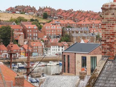 A view of houses and boats in Whitby Harbor at 14 Brunswick Street Whitby