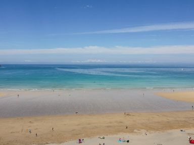 A beach with people enjoying at Seaside Retreat in Newquay