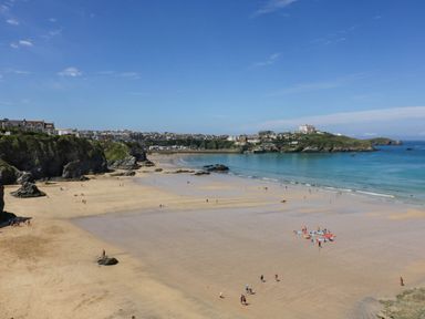 A beach scene with people and water at Seaside Retreat in Newquay