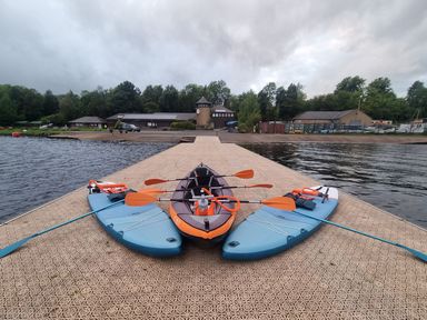 Three watercraft on a dock at 2 Bedroom Sleeps 4 Lodge Smart Tv Hot tub Dogs Ok near Lochwinnoch
