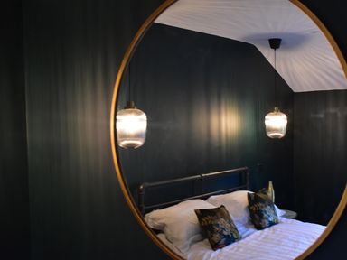 A bedroom with a bed and bedside lights at Yr Hen Beudy Barn Conversion Sleeps 4 Dogs Ok near Brodle Farm near Llansteffan
