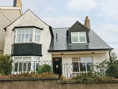 A house with varied windows and a front door at 11 Bryn Goleu Avenue North Holyhead