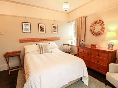 A bedroom with a bed and furniture at 11 Bryn Goleu Avenue North Holyhead
