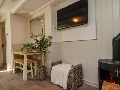 A dining room with a table and chairs at Blue Cottage in Malton