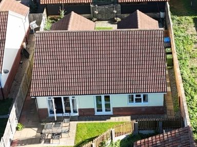 A house with a patio and garden at The Mill House Apartment in Oulton Broad