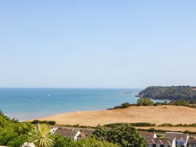 A view of a beach and ocean at Elberry Cove View in Paignton