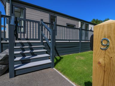 A property exterior with stairs and number 9 sign at Lakewood Plot 9 St. Osyth