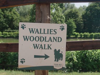 A sign for Wallies Woodland Walk at Pump Hill Caravan Park