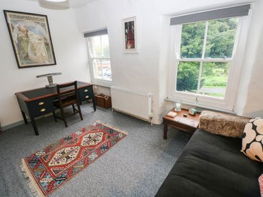 A living room with a desk and sofa at 11 Church Street Narberth