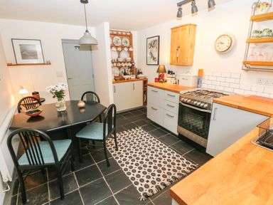 A kitchen with dining table and chairs at 11 Church Street Narberth