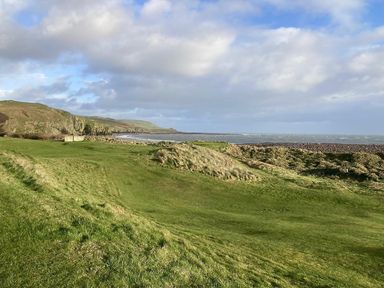 A coastal view with grass landscape and ocean at Beautifully Presented 2 Bedroom Static Caravan in Monreith near Whithorn