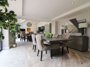 A dining room with a large table and chairs at Northumberland Luxury Stays - The Chivits near Amble